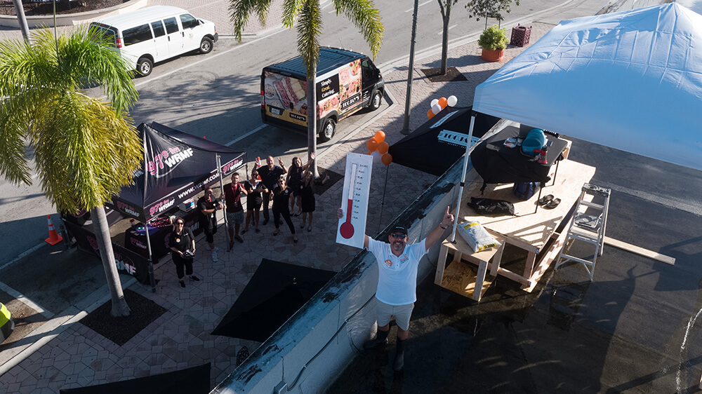 An aerial view of TooJay’s President and CEO Max Piet on top of the Lake Worth restaurant’s roof.